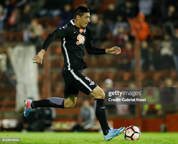 Oscar Cardozo of Libertad kicks the ball to score the second goal of his team during a first leg match between Huracan and Libertad as part of second...