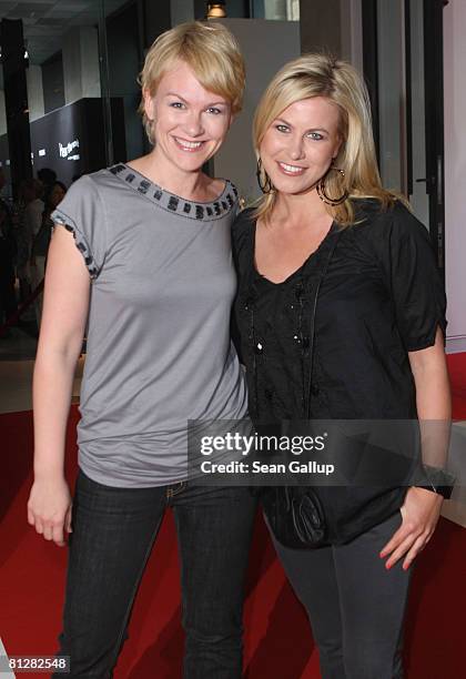 Television hostess Nadine Krueger and friend Karen Heinrichs attend the opening of the Bryan Adams photo exhibition "Hear the World" on May 29, 2008...