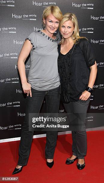 Karen Heinrichs and Nadine Krueger attend the opening of Bryan Adam's exhibition 'Hear the World' on May 29, 2008 in Berlin, Germany.