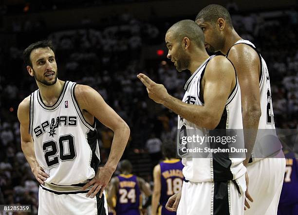 Tony Parker and Manu Ginobili of the San Antonio Spurs talk while Tim Duncan stands alongside while taking on the Los Angeles Lakers in Game Four of...