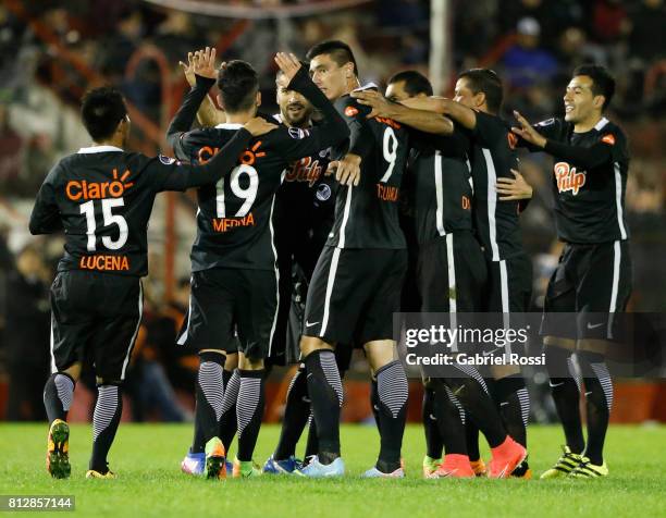 Antonio Bareiro of Libertad celebrates with teammates Oscar Cardozo, Angel Cardozo Lucena, Jesus Medina and Alan Benitez after scoring the fourth...