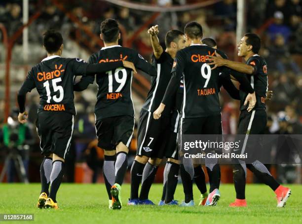 Antonio Bareiro of Libertad celebrates with teammates Oscar Cardozo, Angel Cardozo Lucena, Jesus Medina and Alan Benitez after scoring the fourth...