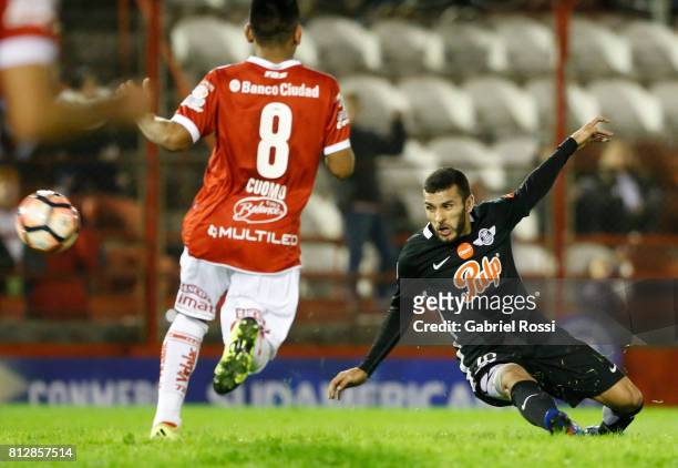 Antonio Bareiro of Libertad kicks the ball to score the fourth goal of his team during a first leg match between Huracan and Libertad as part of...