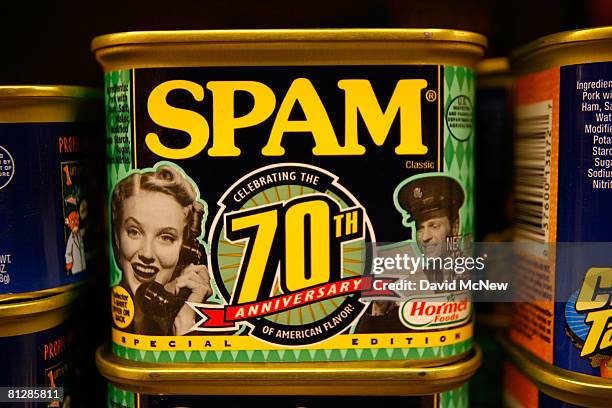 Seventieth anniversary cans of Spam, the often-maligned classic canned lunch meat made by Hormel Foods, are seen on a grocery store shelf May 29,...