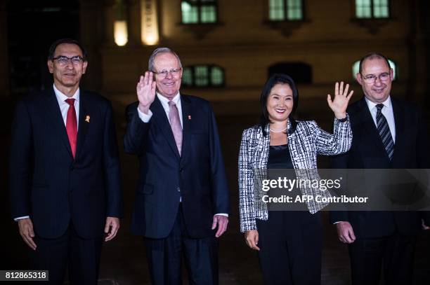 Peru's President Pedro Pablo Kuczynski and the leader of Fuerza Popular party, Keiko Fujimori wave after a private meeting at the Peruvian...