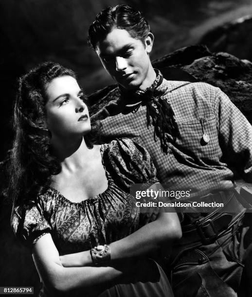 Actress Jane Russell and actor Jack Buetel in a portrait session for the movie "The Outlaw" which was released on February 5, 1943.