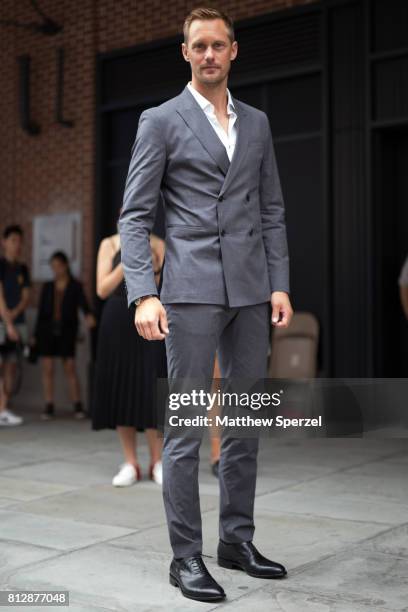 Alexander Skarsgard is seen attending BOSS during Men's New York Fashion Week wearing Hugo Boss on July 11, 2017 in New York City.