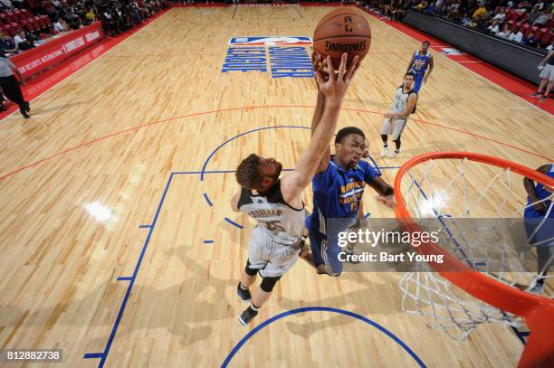 Matt Costello of the Minnesota Timberwolves blocks the shot of Damian Jones of the Golden State Warriors on July 11, 2017 at the Thomas & Mack Center...