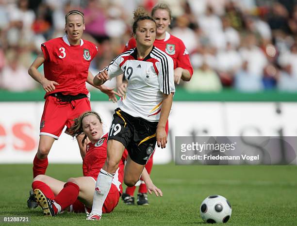 Emma Jones of Wales battles for the ball with Fatmire Bajramaj of Germany during the Women's Euro 2009 qualifier between Germany and Wales at the Aue...