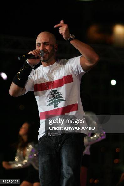 Messari Singer Lebanese-Canadian singer Massari wears a T-shirt sporting a Lebanese ...