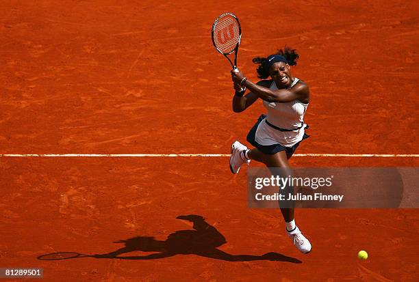 Serena Williams of USA hits a backhand during the Women's Singles third round match against Katarin Srebotnik of Slovenia on day six of the French...