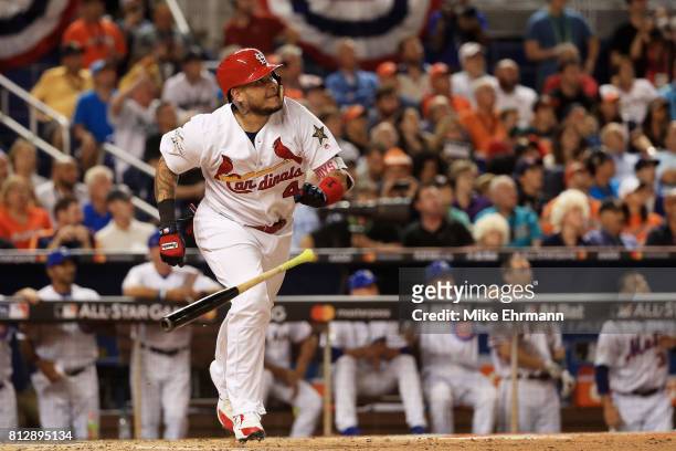 Yadier Molina of the St. Louis Cardinals and the National League reacts after hitting a solo home run in the sixth inning against the American League...