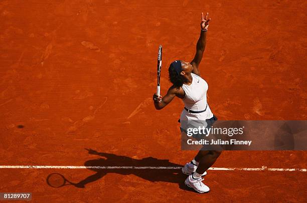 Serena Williams of USA serves during the Women's Singles third round match against Katarin Srebotnik of Slovenia on day six of the French Open at...