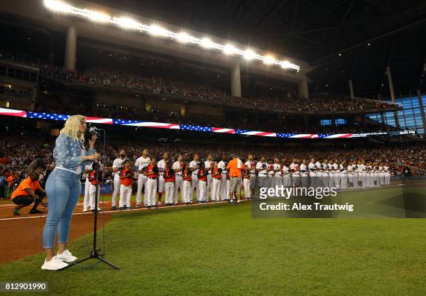 Bebe Rexha sings the national anthem before the 88th MLB All-Star Game at Marlins Park on Tuesday, July 11, 2017 in Miami, Florida.