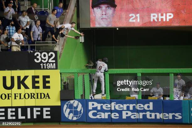 Justin Upton of the Detroit Tigers and the American League is unable to catch a solo home run ball hit by Yadier Molina of the St. Louis Cardinals...