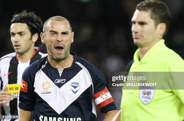 Melbourne Victory's Kevin Muscat yells abuse at referee Ben Williams after Juventus was awarded a penalty during their friendly match at the...