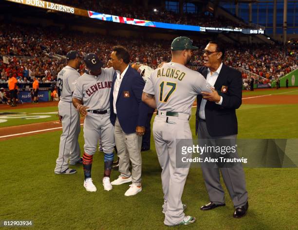 American League All-Stars Francisco Lindor of the Cleveland Indians and Yonder Alonso of the Oakland Athletics greet Latin-born Hall of Famers...