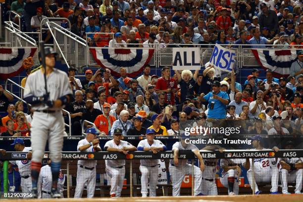 Fans dress up as judges as they cheer on American League All-Star Aaron Judge of the New York Yankees during the 88th MLB All-Star Game at Marlins...