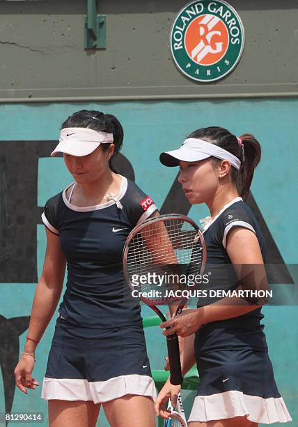 Chinese players Zi Yan and Jie Zheng speaks together after winning a point against Russian Alla Kudryavtseva and German Martina Muller during their...