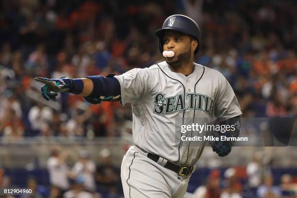 Robinson Cano of the Seattle Mariners and the American League celebrates hitting a home run in the tenth inning against the National League during...