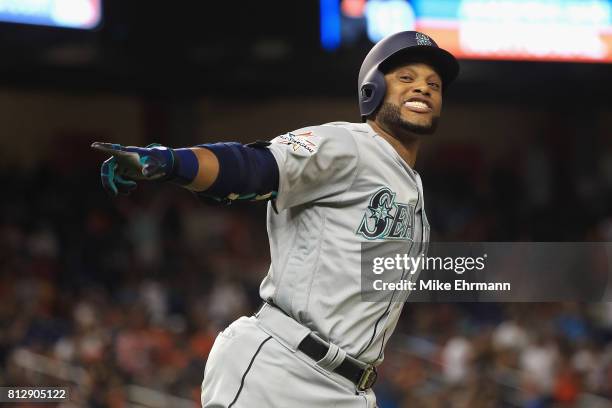 Robinson Cano of the Seattle Mariners and the American League celebrates hitting a home run in the tenth inning against the National League during...