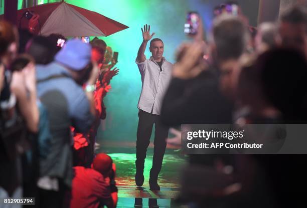 Designer Raf Simons greets his guests at his Spring/Summer 2018 show on July 11, 2017 in New York City. / AFP PHOTO / ANGELA WEISS