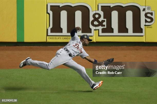 Justin Upton of the Detroit Tigers and the American League catches a ball hit by Corey Seager of the Los Angeles Dodgers and the National League for...