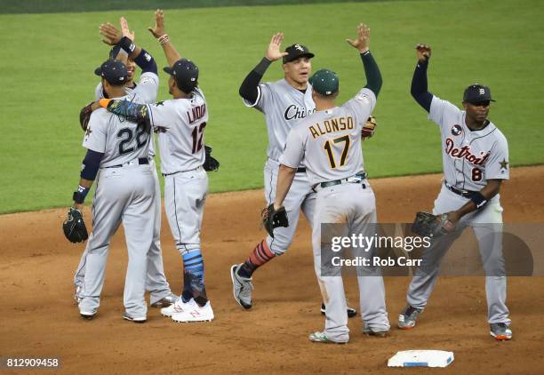 Robinson Cano of the Seattle Mariners and the American League celebrates with teammates after they defeated the National League 2 to 1 during the...