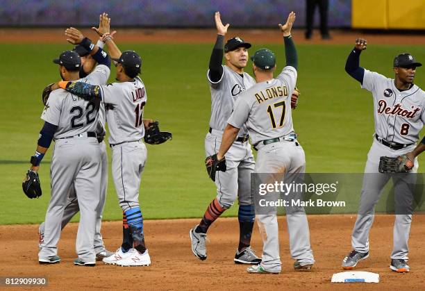 Robinson Cano of the Seattle Mariners and the American League celebrates with teammates after they defeated the National League 2 to 1 during the...