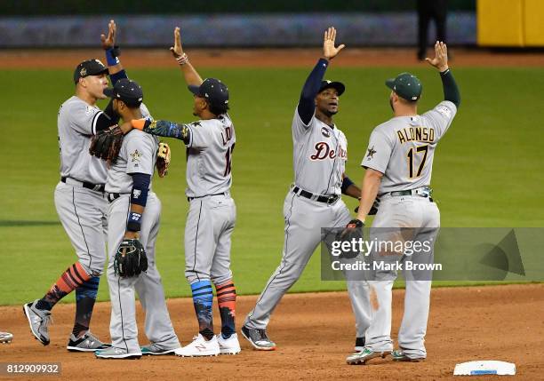 Robinson Cano of the Seattle Mariners and the American League celebrates with teammates after they defeated the National League 2 to 1 during the...