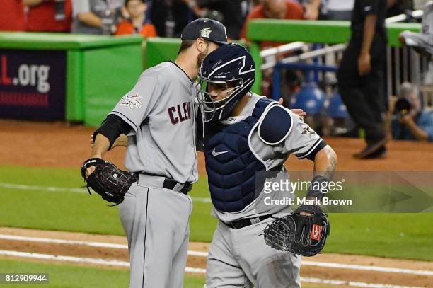 Andrew Miller of the Cleveland Indians and the American League and Gary Sanchez of the New York Yankees and the American League celebrate defeating...