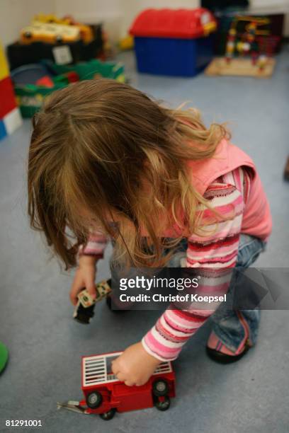 Child plays with a toy on May 30, 2008 in Wuppertal-Barmen, Germany. Unicef, United Nation's Children's Fund reports an alarming increase of child...