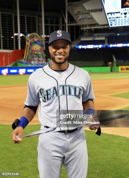 Robinson Cano of the Seattle Mariners and the American League celebrates with the Major League Baseball All-Star Game Most Valuable Player Award...