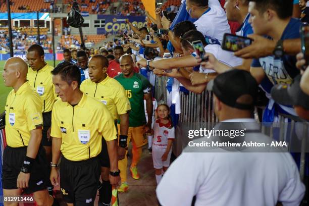 Florent Malouda of French Guiana leads his country out onto the pitch prior to the 2017 CONCACAF Gold Cup Group A match between Honduras and French...