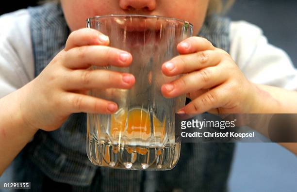 Child drinks juice on May 30, 2008 in Wuppertal-Barmen, Germany. Unicef, United Nation's Children's Fund reports an alarming increase of child...