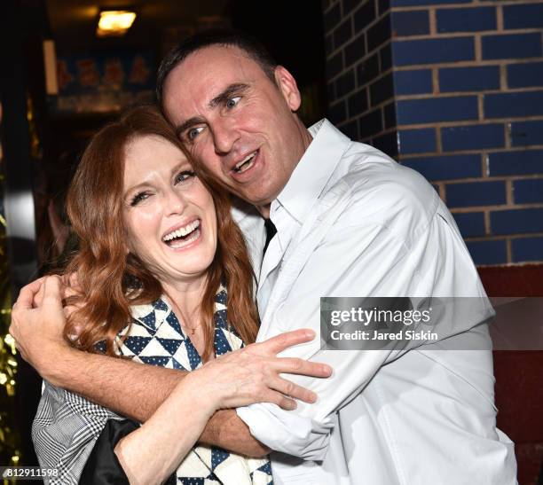 Actress Julianne Moore and Raf Simons attend Raf Simons Front Row during NYFW Men's at Golden Sun Life Day Care on July 11, 2017 in New York City.