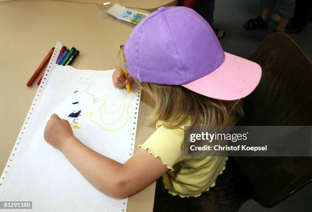 Child paints a image on May 30, 2008 in Wuppertal-Barmen, Germany. Unicef, United Nation's Children's Fund reports an alarming increase of child...