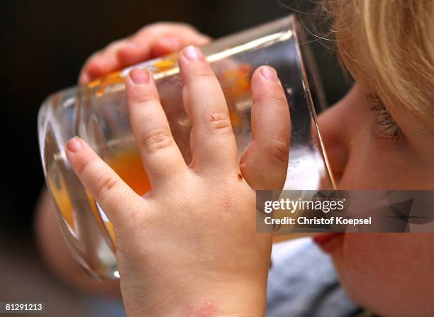 Child drinks juice at the Wuppertal Tafel on May 30, 2008 in Wuppertal-Barmen, Germany. Unicef, United Nation's Children's Fund reports an alarming...