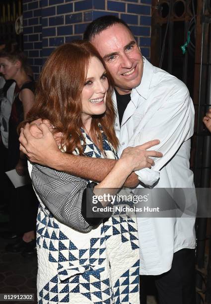 Julianne Moore and designer Raf Simons attend the Raf Simons - Front Row/Backstage at NYFW: Men's July 2017 on July 11, 2017 in New York City.