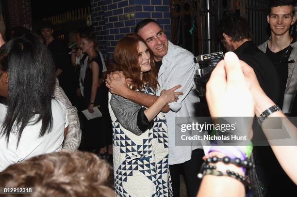 Julianne Moore and designer Raf Simons attend the Raf Simons - Front Row/Backstage at NYFW: Men's July 2017 on July 11, 2017 in New York City.