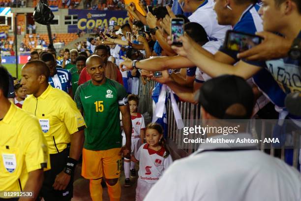 Florent Malouda of French Guiana leads his country out onto the pitch prior to the 2017 CONCACAF Gold Cup Group A match between Honduras and French...