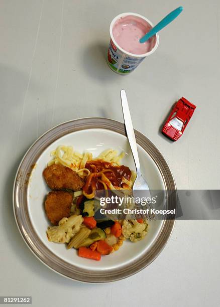 Children receive a warm meal at the Wuppertal Tafel on May 30, 2008 in Wuppertal-Barmen, Germany. Unicef, United Nation's Children's Fund reports an...