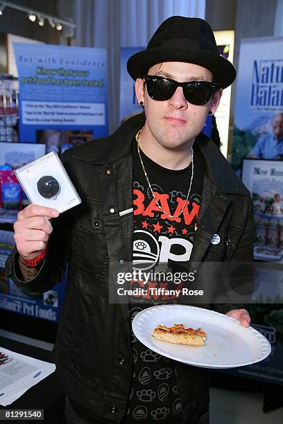 Musician Joel Madden poses with a gift at Melanie Segal's Hollywood Platinum Lounge at The W Hotel for the MTV Awards Day 1 on May 29, 2008 in Los...