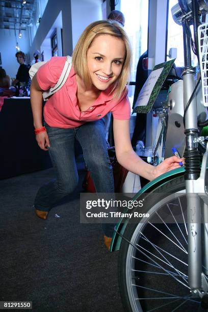 Actress Rachael Leigh Cook autographs a green bike at Melanie Segal's Hollywood Platinum Lounge for the MTV Movie Awards Day 1 at The W Hotel on May...