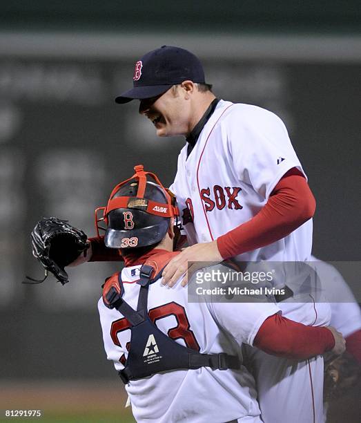 Jon Lester of the Boston Red Sox is hoisted by catcher Jason Varitek after pitching a no-hitter against the Kansas City Royals at Fenway Park in...