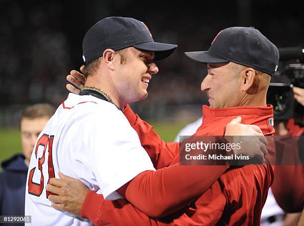Jon Lester of the Boston Red Sox is greeted by Red Sox Manager Terry Francona after pitching a no-hitter against the Kansas City Royals at Fenway...