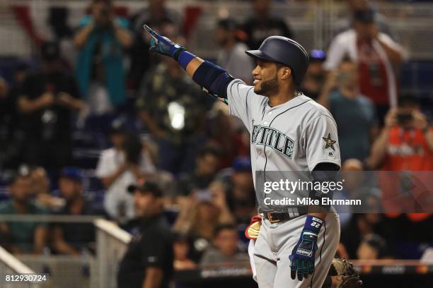 Robinson Cano of the Seattle Mariners and the American League celebrates hitting a home run in the tenth inning against the National League during...