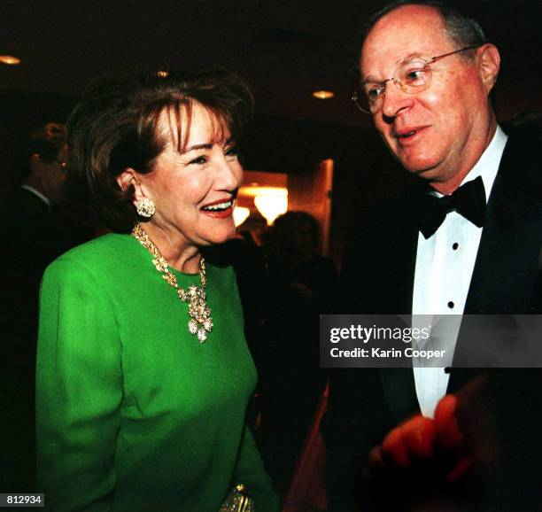 Elizabeth Dole chats with US Supreme Court Justice Anthony Kennedy at a benefit dinner for outstanding science students March 6, 1999 in Washington,...
