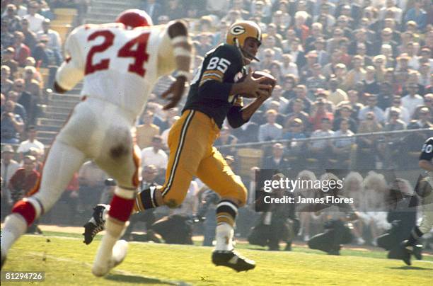 Kansas City Chiefs cornerback Fred Williamson chases Green Bay Packers wide receiver Max McGee in Super Bowl I, a 35-10 Packers victory on January 15...