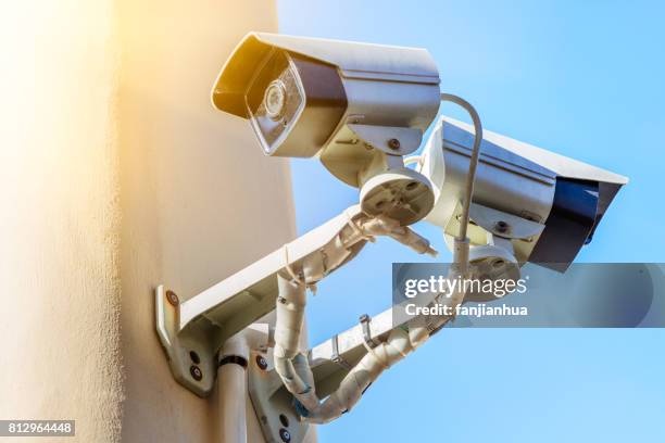 cctv security camera against blue sky - security camera view stock pictures, royalty-free photos & images